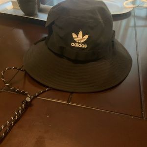 adidas bucket hat black with white writing side pocket